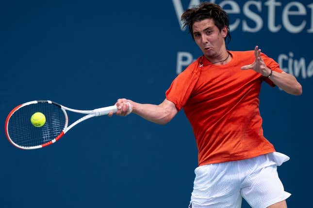 Alexander Shevchenko, of Russia, returns to Marton Fucsovics, of Hungary, during the Western &amp;amp; Southern Open qualifying round in Cincinnati on Saturday, Aug. 12, 2023.