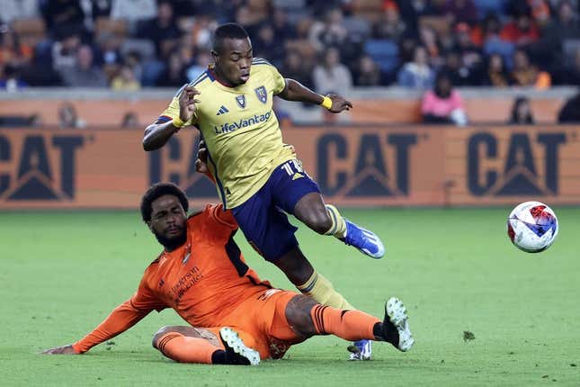 Nov 11, 2023; Houston, Texas, USA; Real Salt Lake forward Carlos Andres Gomez (11) and Houston Dynamo defender Micael (31) battle for the ball during the second half at Shell Energy Stadium.